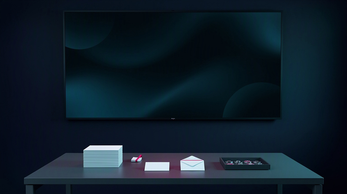 Minimal operations room with dark abstract display and neatly arranged blank cards and envelopes.